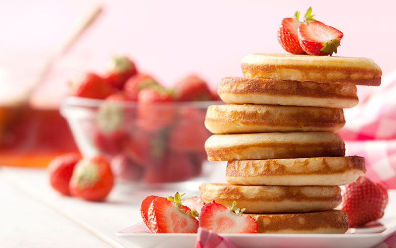 Pancake stack with fresh strawberries